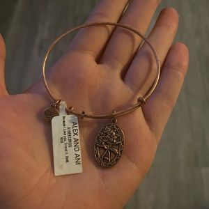 Alex and Ani “friend” charm bangle. Rose-gold tone. Never worn with tags.